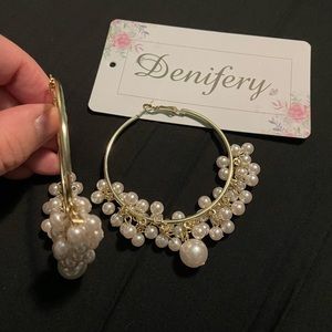 Gold hoop earrings with dangling pearls